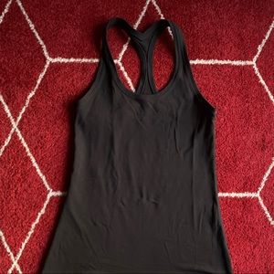 Lululemon tank stretchy. Fits small like a 4 no size dot